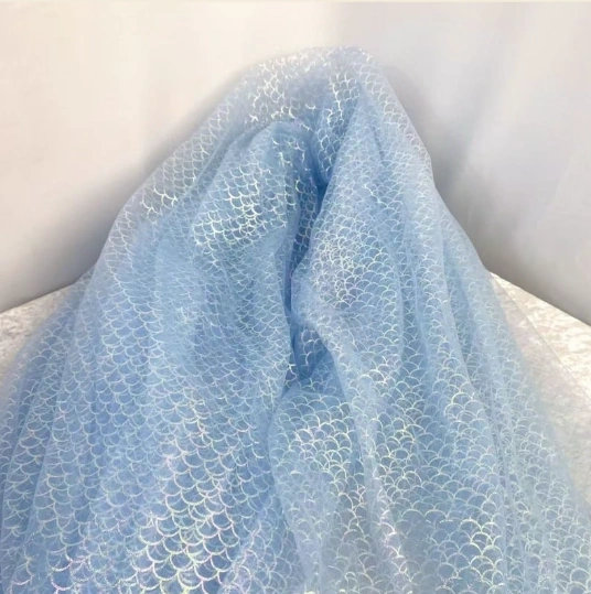 Close view of translucent blue mesh with a fine scale-like surface